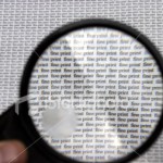 ist2_242782-fine-print-text-viewed-thorugh-magnifying-glass